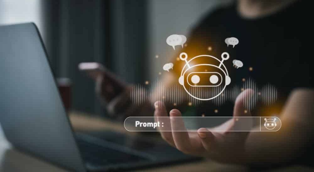 Mākslīgā intelekta regulējums Persona pie datora un viedtālruņa, vizualizēts mākslīgā intelekta čatbots ar runas viļņiem un ikonu 'Prompt:', attēlojot Skrivanek interesi par mākslīgā intelekta regulējumu un tā integrāciju valodu tehnoloģijās.
